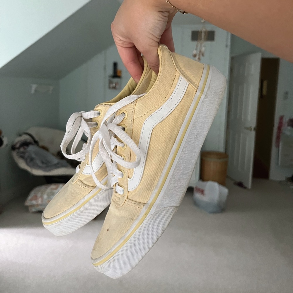 Pastel yellow low cut Vans slip on shoes